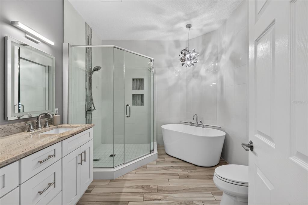 701 Westpark Way, Unit 101 Celebration, FL 34747 - Photo 36 of 69 a spacious bathroom with a double vanity sink mirror and toilet