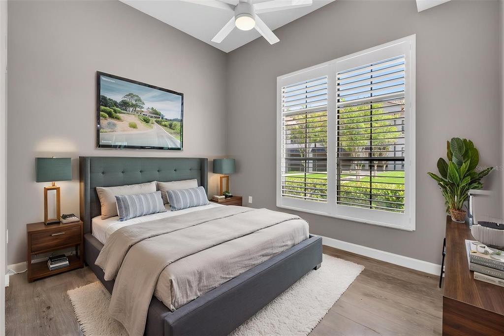 701 Westpark Way, Unit 101 Celebration, FL 34747 - Photo 44 of 69 a bedroom with a large bed and a window