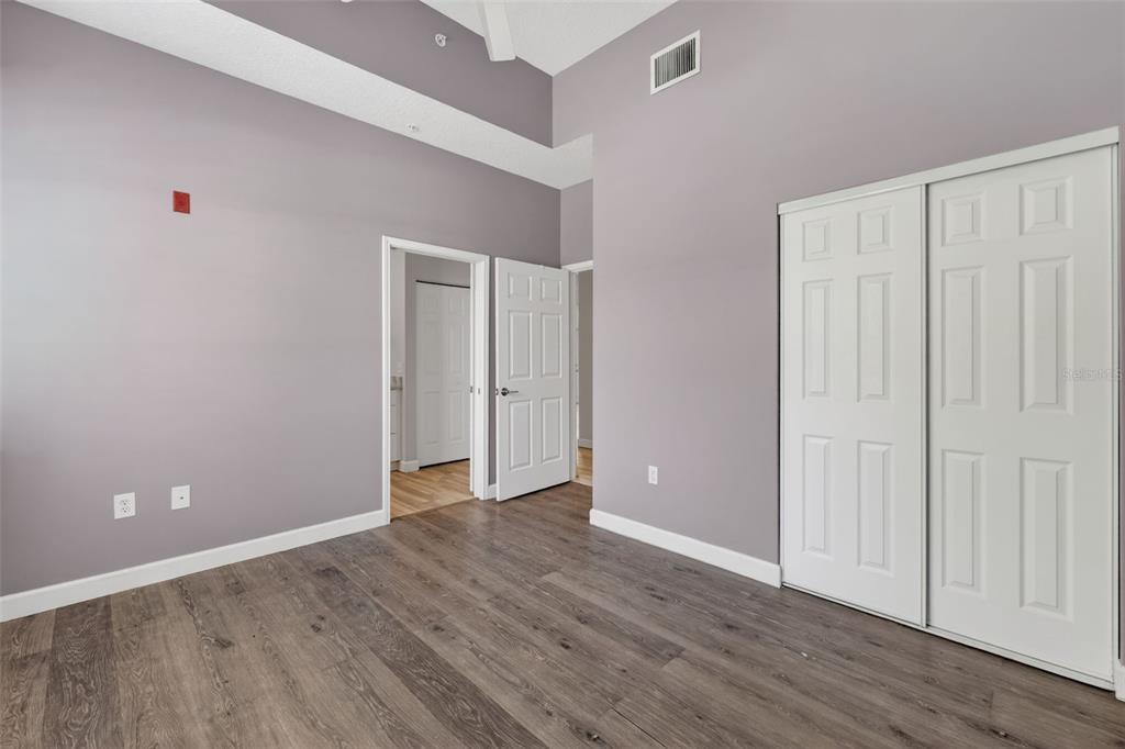 701 Westpark Way, Unit 101 Celebration, FL 34747 - Photo 48 of 69 a view of an empty room with wooden floor
