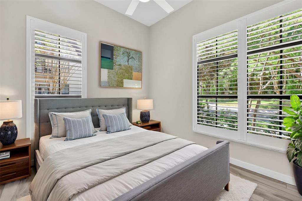 701 Westpark Way, Unit 101 Celebration, FL 34747 - Photo 51 of 69 a bedroom with a large bed and a window
