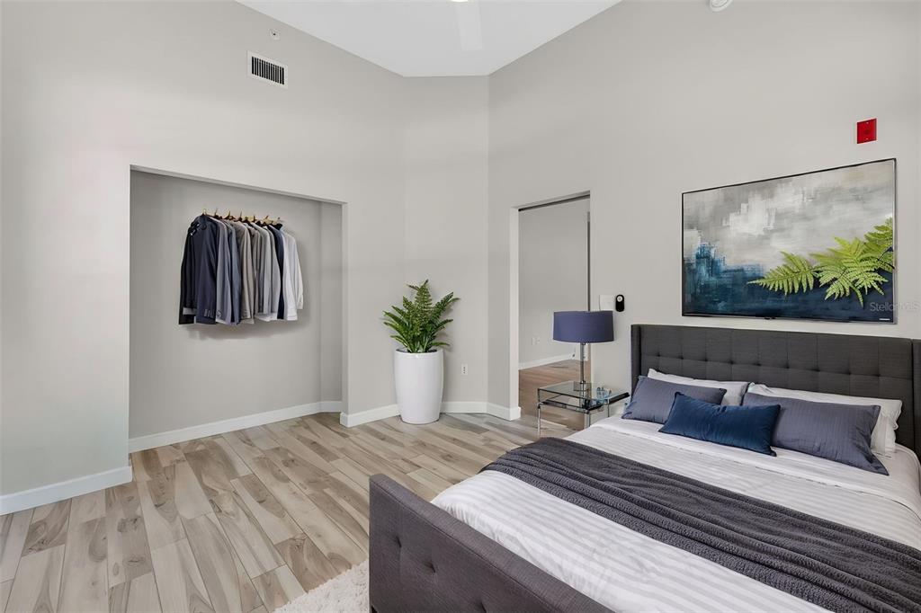 701 Westpark Way, Unit 101 Celebration, FL 34747 - Photo 53 of 69 a bedroom with a bed and window