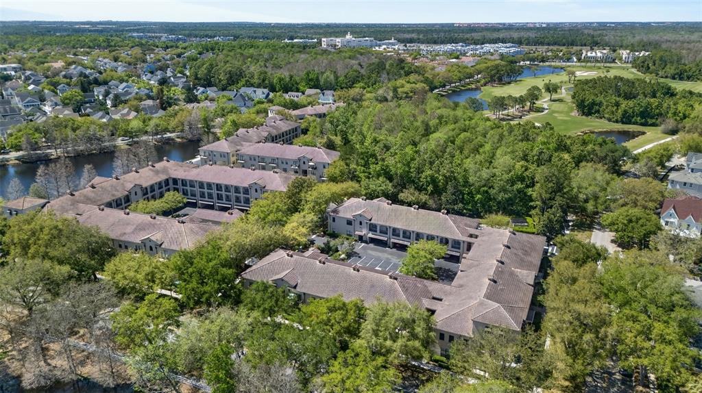 701 Westpark Way, Unit 101 Celebration, FL 34747 - Photo 61 of 69 an aerial view of a house with outdoor space and a lake view