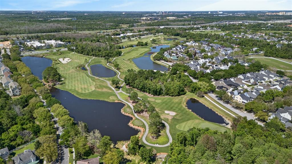 701 Westpark Way, Unit 101 Celebration, FL 34747 - Photo 65 of 69 an aerial view of residential house with outdoor space and river view