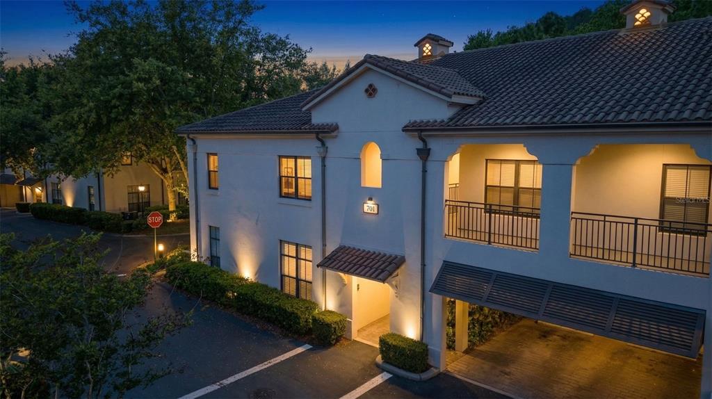 701 Westpark Way, Unit 101 Celebration, FL 34747 - Photo 68 of 69 a front view of a house with a yard