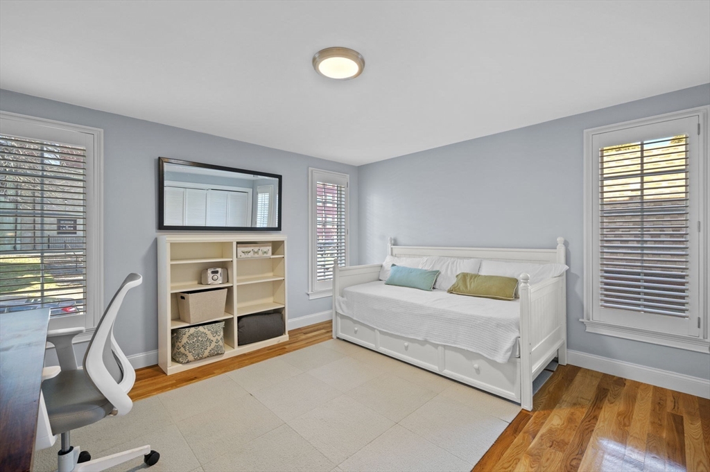 9 Hanover Court, Unit 1 Marblehead, MA 01945 - Photo 14 of 38 a bedroom with a bed and a window