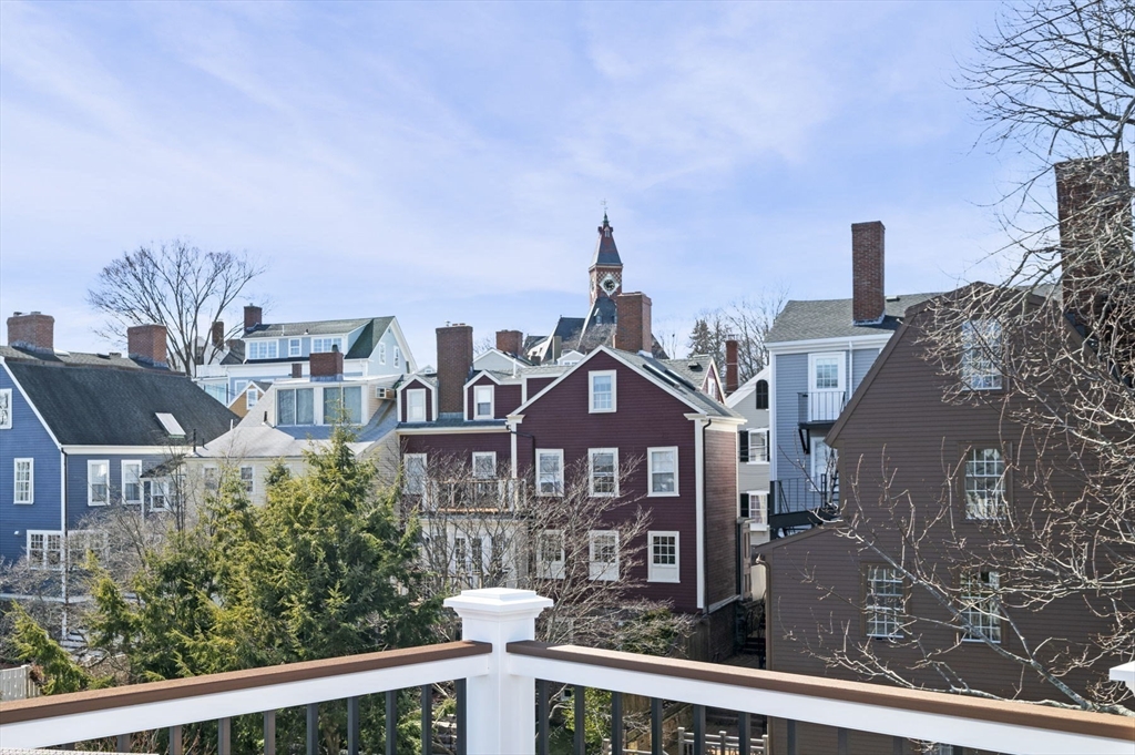 9 Hanover Court, Unit 1 Marblehead, MA 01945 - Photo 23 of 38 a front view of a house with yard