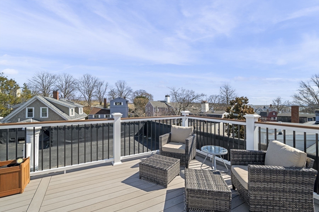 9 Hanover Court, Unit 1 Marblehead, MA 01945 - Photo 24 of 38 a view of a deck with furniture