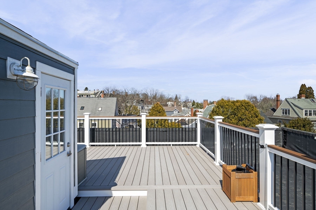9 Hanover Court, Unit 1 Marblehead, MA 01945 - Photo 27 of 38 a view of a balcony with wooden floor