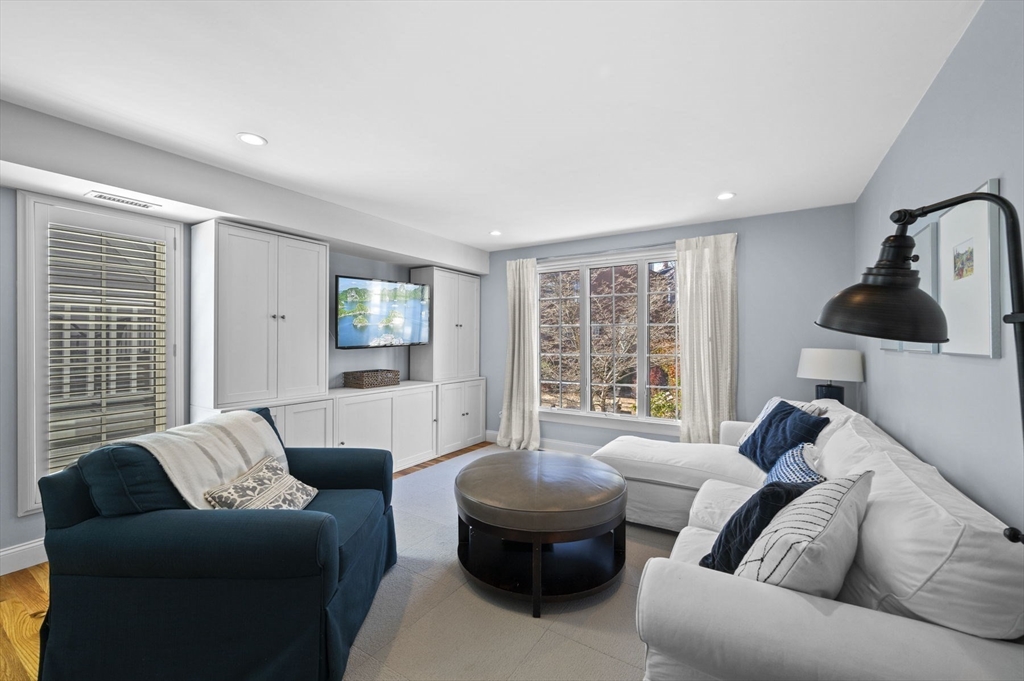 9 Hanover Court, Unit 1 Marblehead, MA 01945 - Photo 3 of 38 a living room with furniture and a large window
