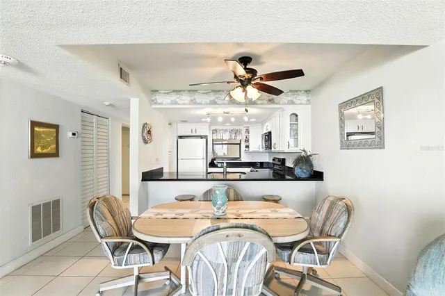 a living room with furniture and a lamp