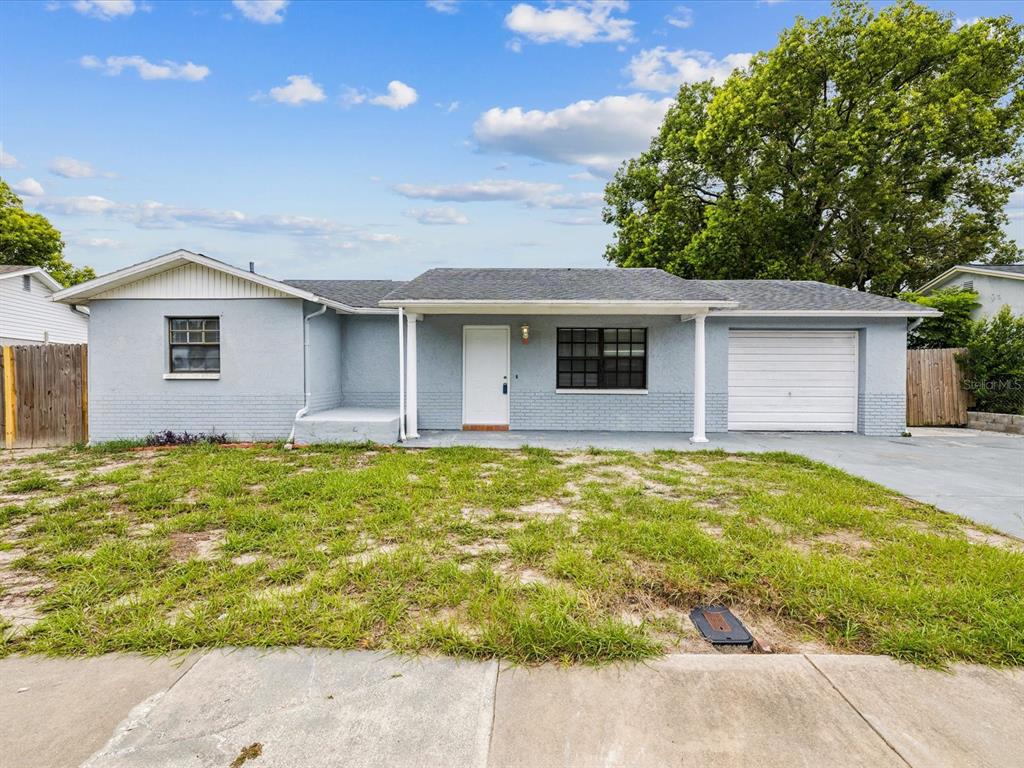 8718 Honeycomb Drive Port Richey, FL 34668 - Photo 1 of 1 a front view of house with yard