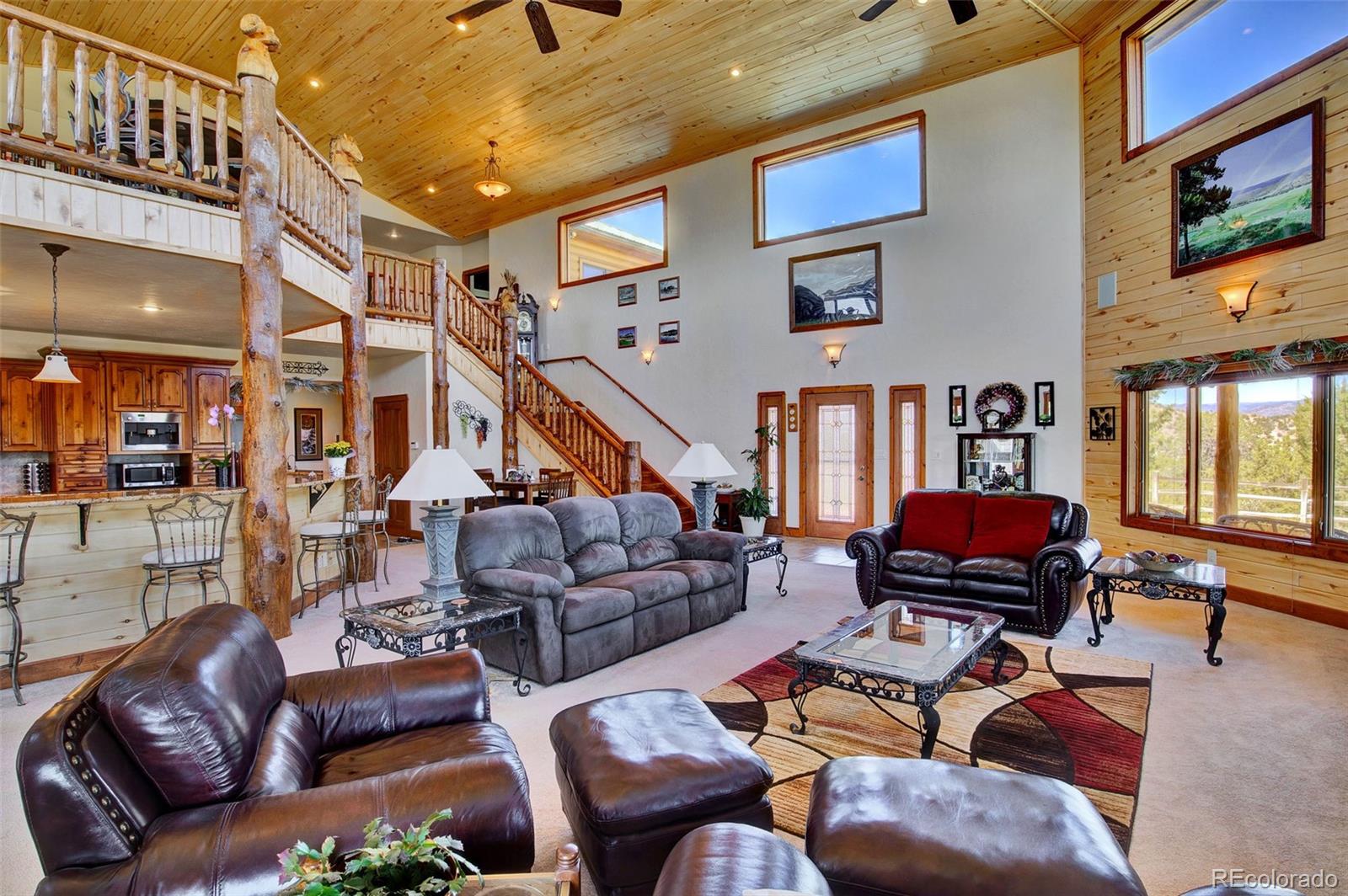 400 Copper Canyon Road Canon City, CO 81212 - Photo 11 of 50 a living room with furniture and a flat screen tv