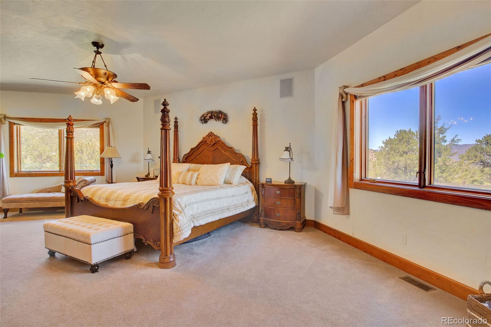 400 Copper Canyon Road Canon City, CO 81212 - Photo 19 of 50 a bedroom with furniture and a large window