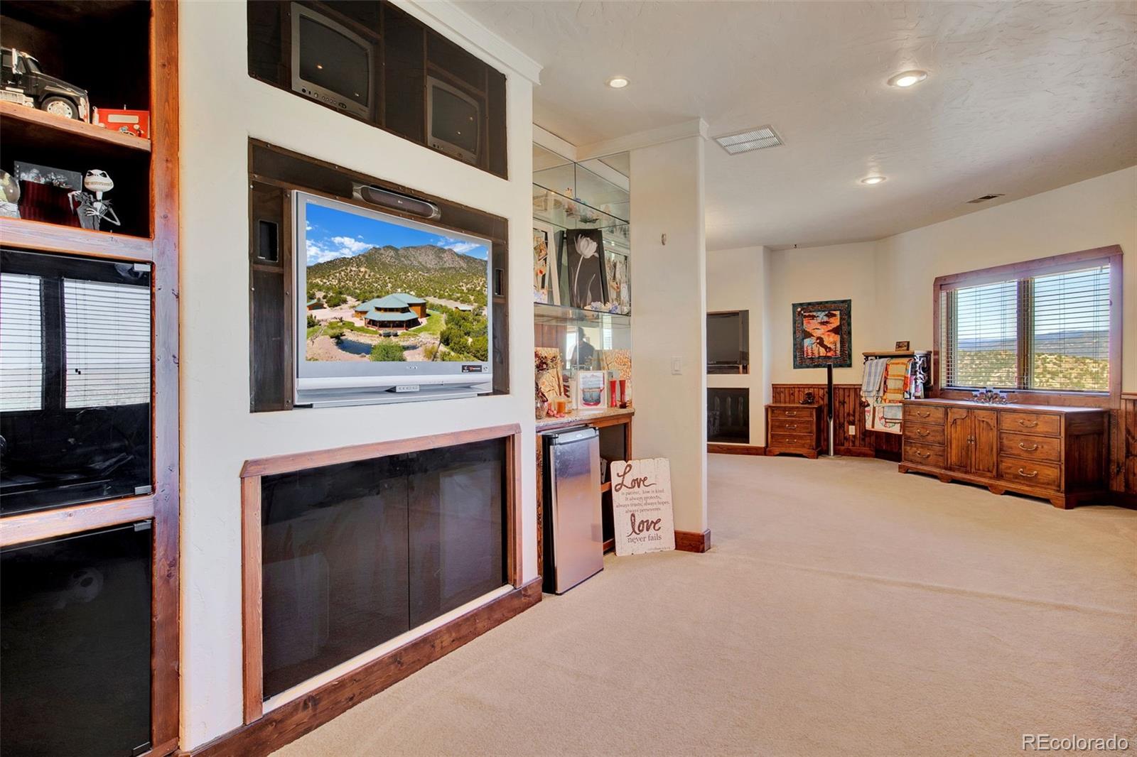 400 Copper Canyon Road Canon City, CO 81212 - Photo 36 of 50 a view of living room with furniture and flat screen tv