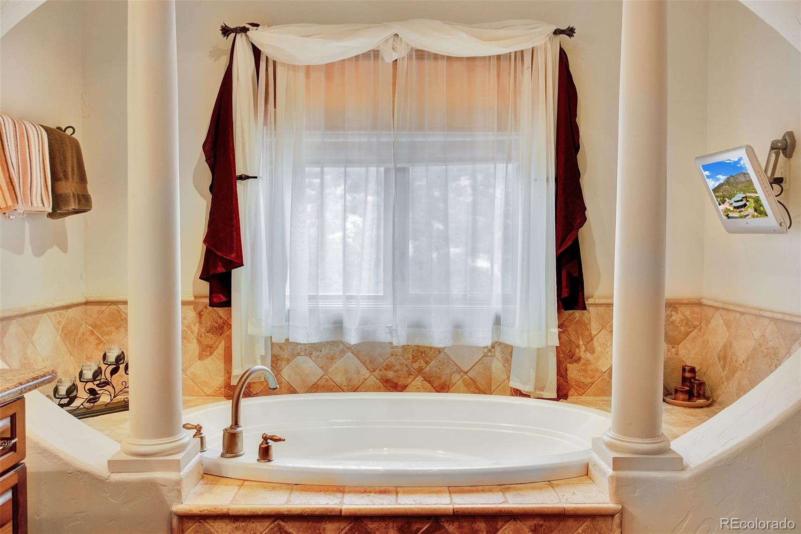 400 Copper Canyon Road Canon City, CO 81212 - Photo 38 of 50 a bathroom with a tub and a shower curtain