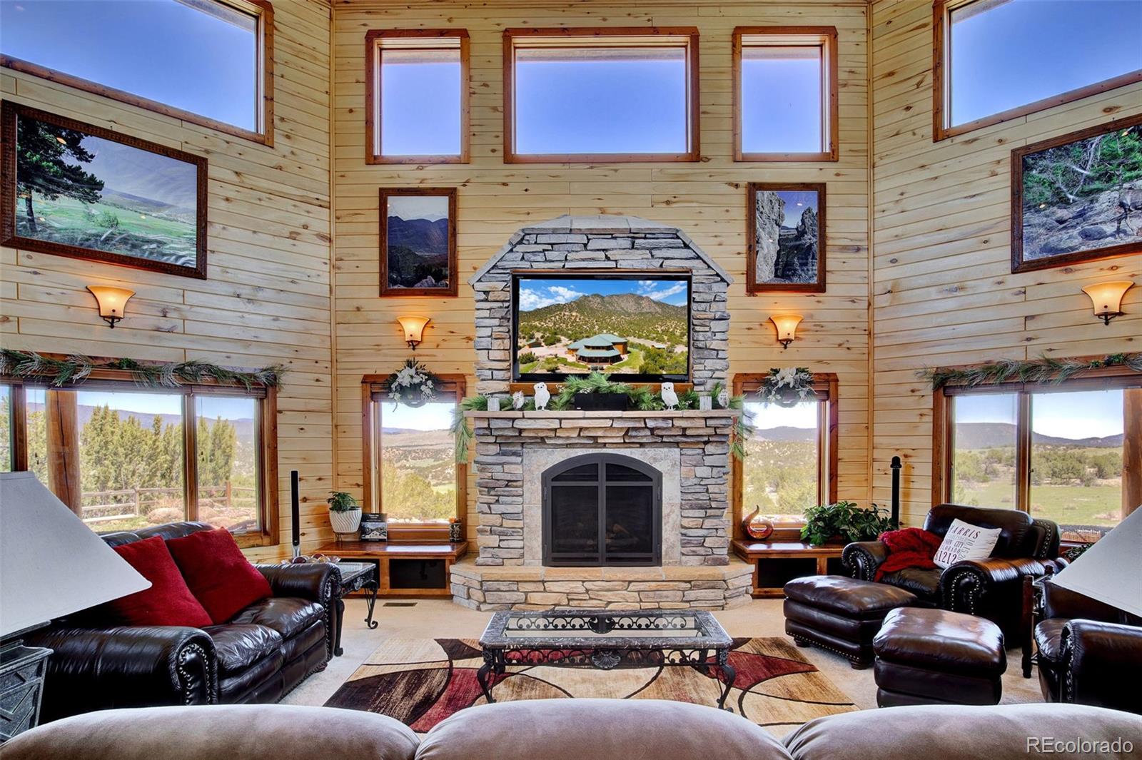 400 Copper Canyon Road Canon City, CO 81212 - Photo 10 of 50 a living room with fireplace furniture and a fireplace