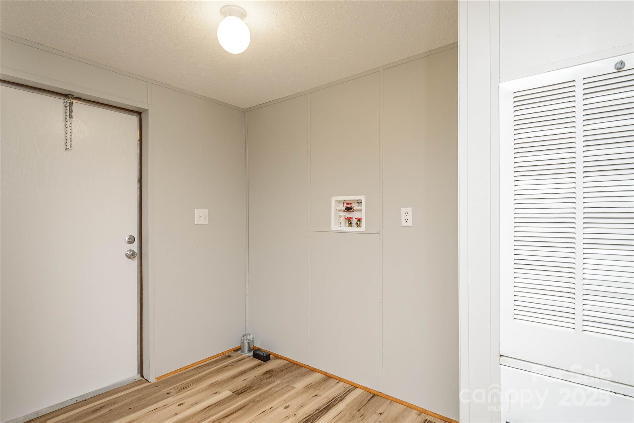 1361 Pleasant Grove Church Road Hendersonville, NC 28739 - Photo 17 of 48 a view of a room with wooden floor and a window