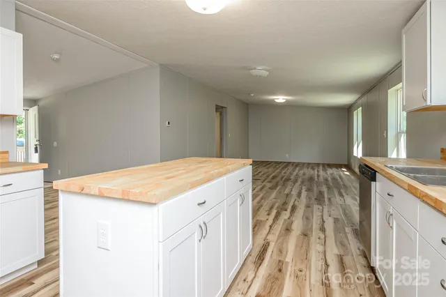 a spacious bathroom with a granite countertop sink