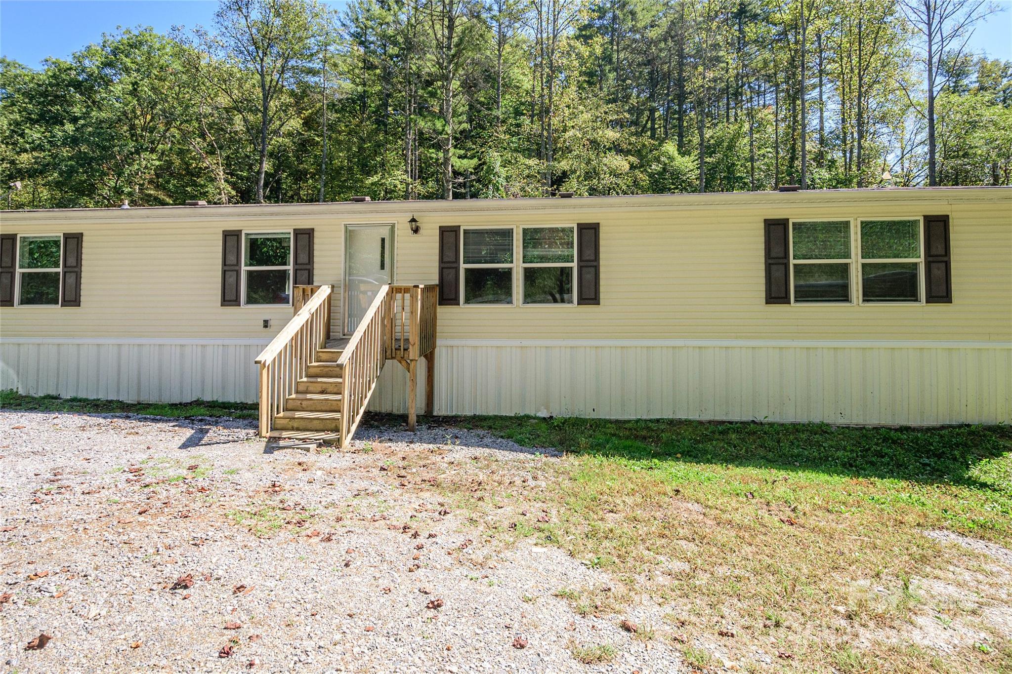 1361 Pleasant Grove Church Road Hendersonville, NC 28739 - Photo 2 of 48 a view of a house with a yard