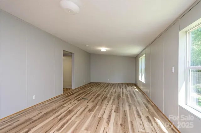 a view of an empty room and window