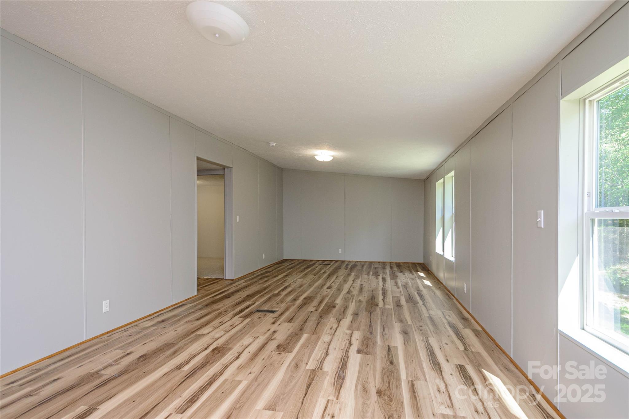 1361 Pleasant Grove Church Road Hendersonville, NC 28739 - Photo 22 of 48 a view of an empty room and window