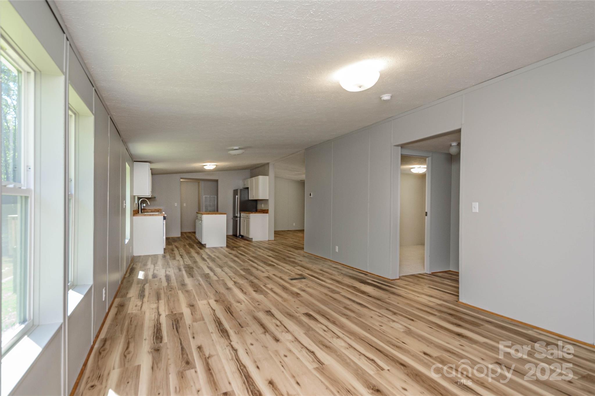 1361 Pleasant Grove Church Road Hendersonville, NC 28739 - Photo 25 of 48 a bedroom with a bed and a view of kitchen