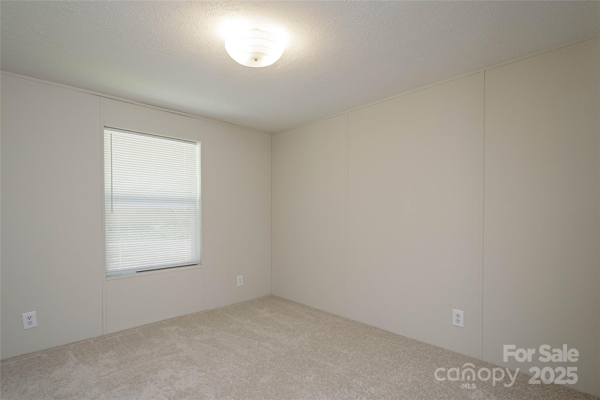 1361 Pleasant Grove Church Road Hendersonville, NC 28739 - Photo 35 of 48 an empty room with a window