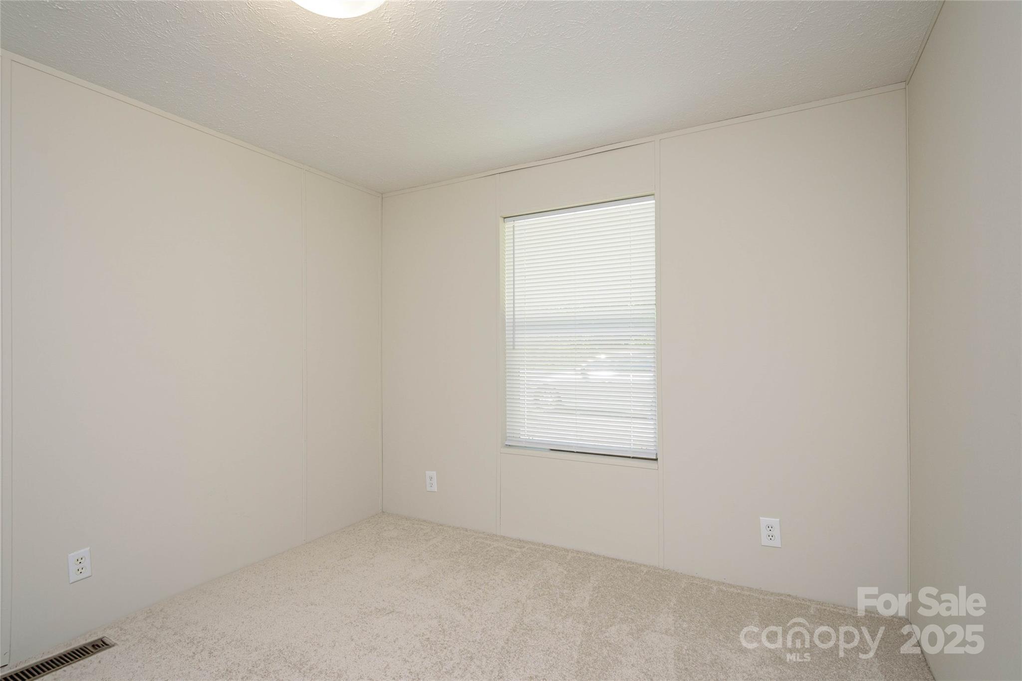 1361 Pleasant Grove Church Road Hendersonville, NC 28739 - Photo 38 of 48 an empty room with windows