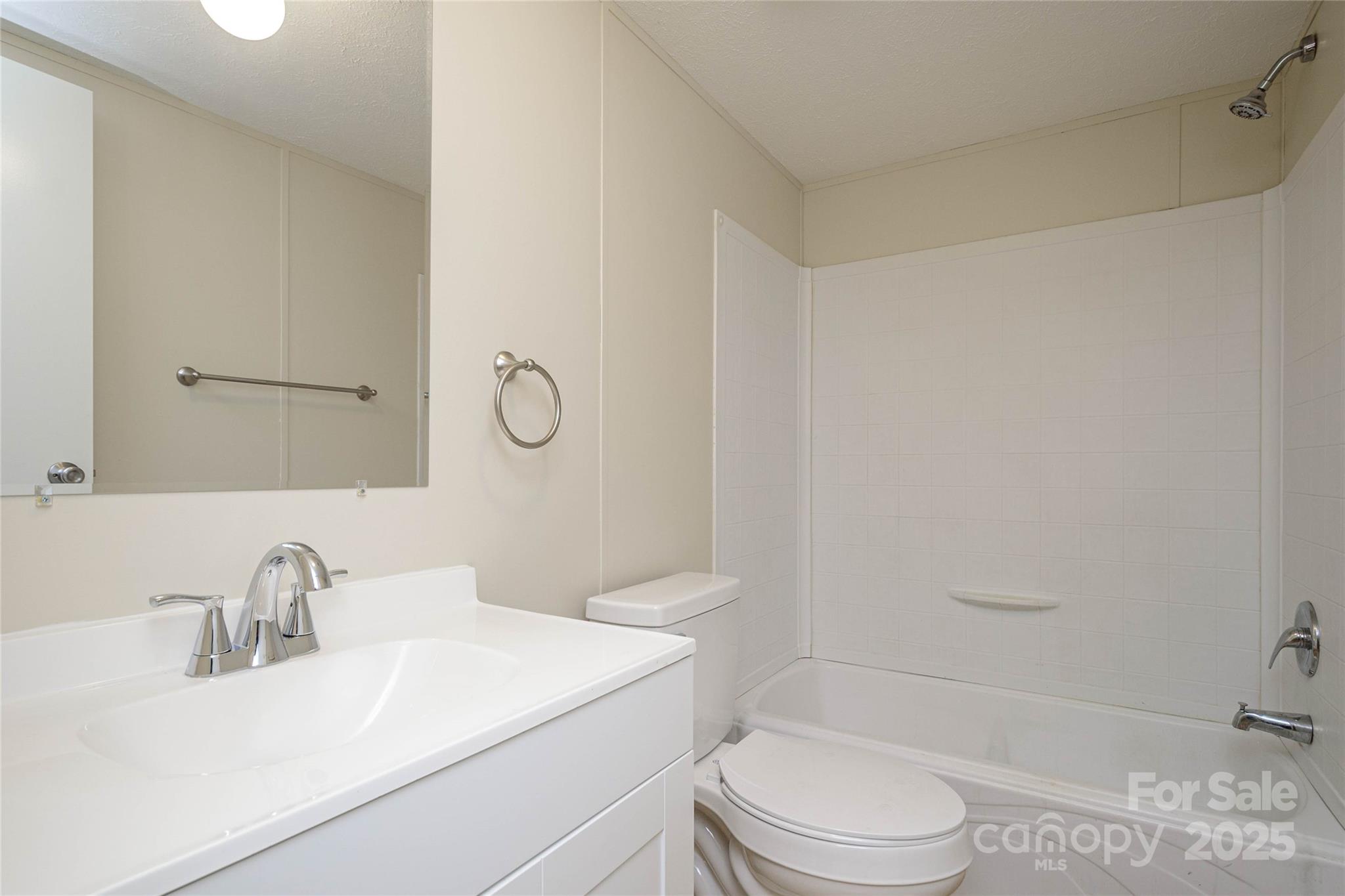 1361 Pleasant Grove Church Road Hendersonville, NC 28739 - Photo 39 of 48 a bathroom with a sink toilet vanity and shower