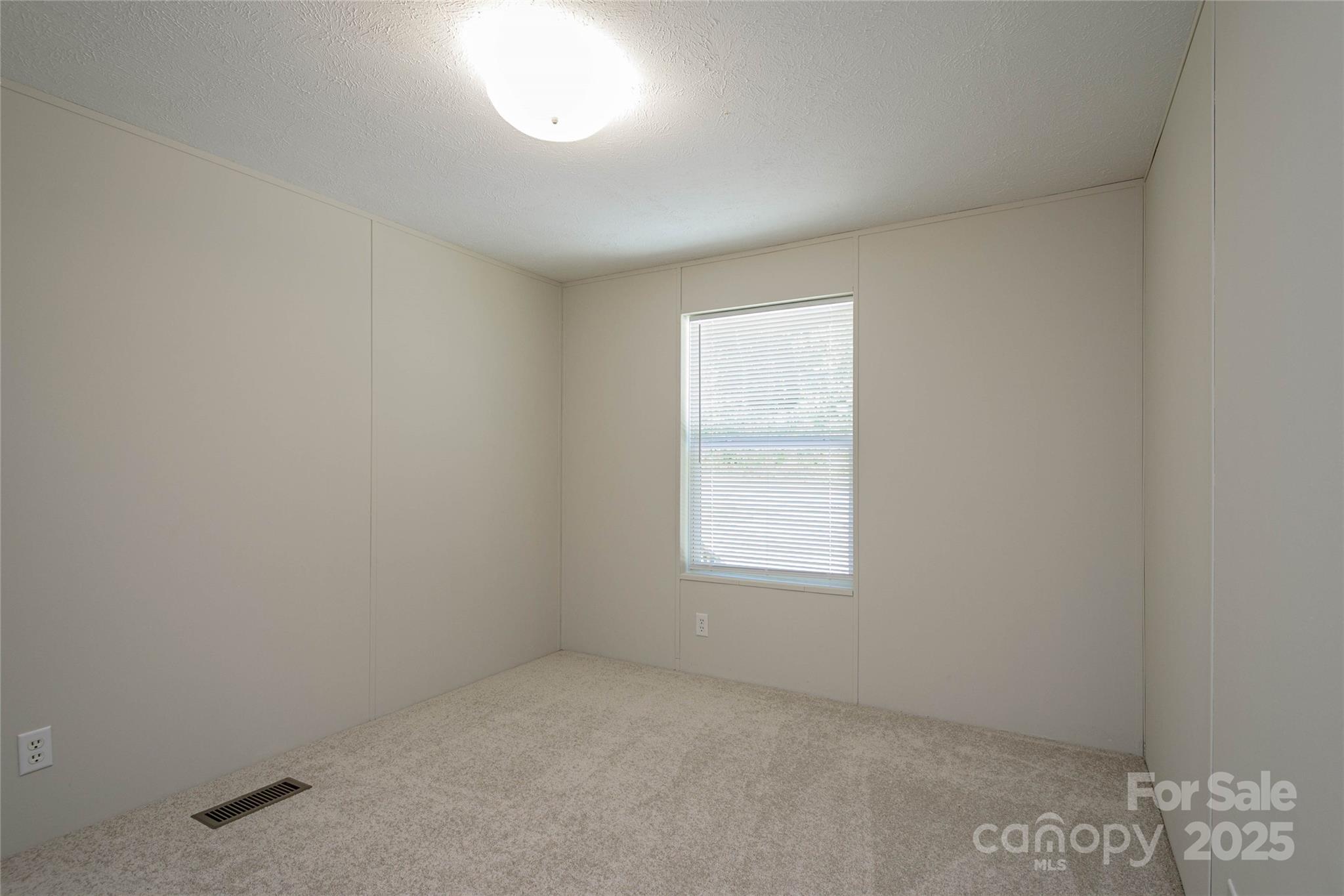 1361 Pleasant Grove Church Road Hendersonville, NC 28739 - Photo 40 of 48 an empty room with a window