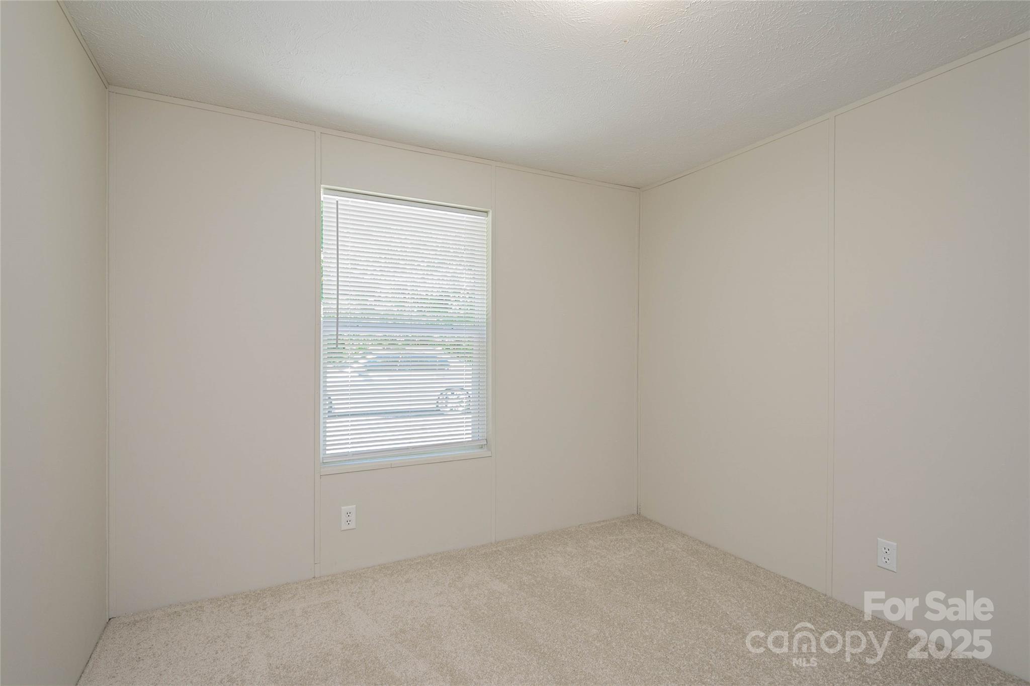 1361 Pleasant Grove Church Road Hendersonville, NC 28739 - Photo 41 of 48 an empty room with a window