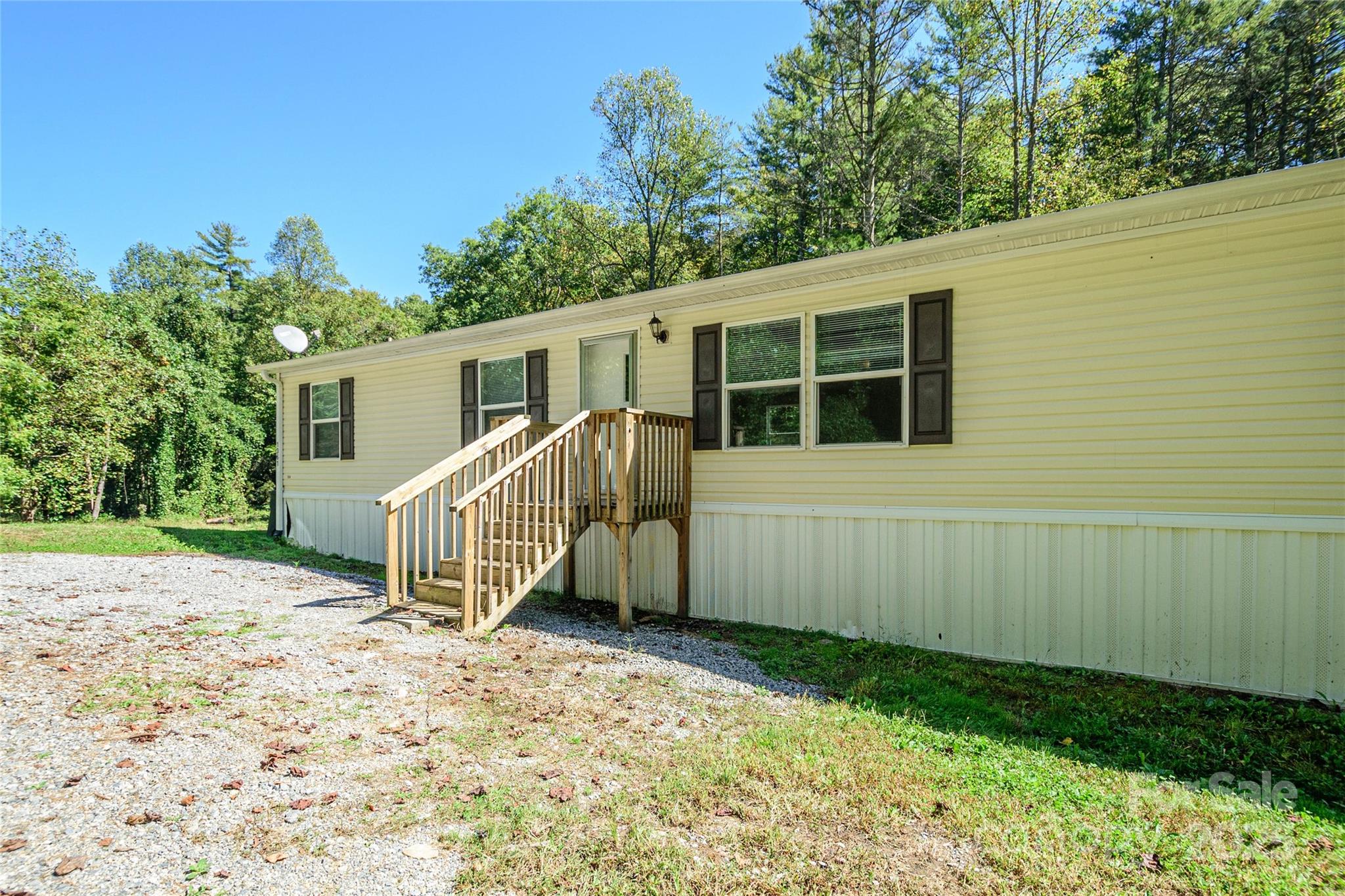 1361 Pleasant Grove Church Road Hendersonville, NC 28739 - Photo 7 of 48 a view of a house with a yard