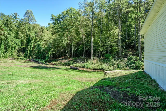 a view of outdoor space with deck and yard