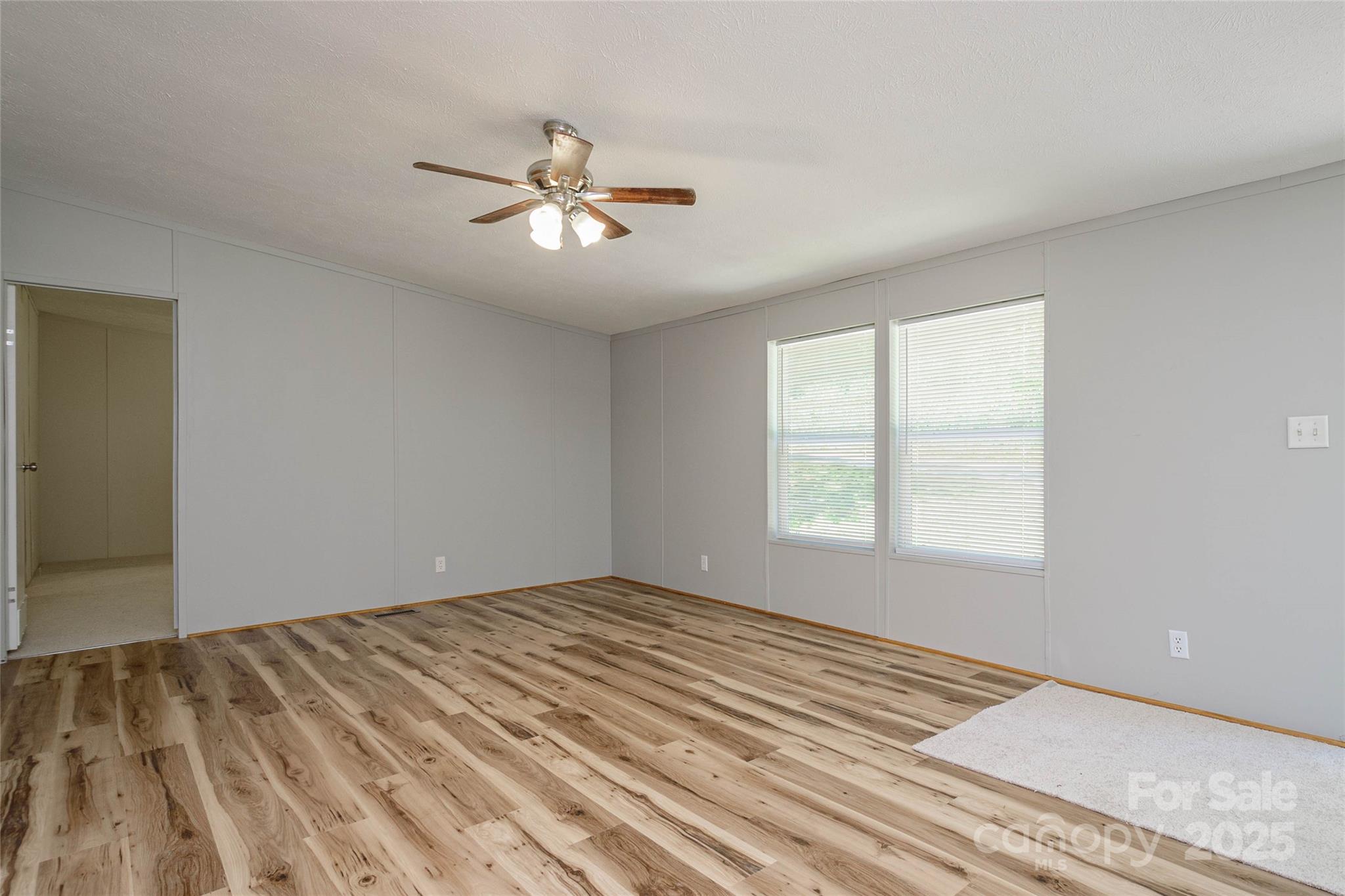 1361 Pleasant Grove Church Road Hendersonville, NC 28739 - Photo 10 of 48 a view of a room with a window and a ceiling fan