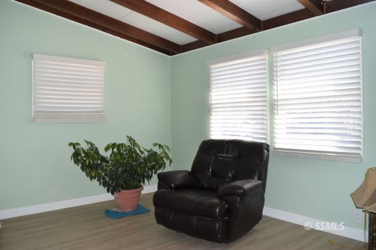 401 North Florence Street Ridgecrest, CA 93555 - Photo 13 of 21 a living room with furniture and a potted plant