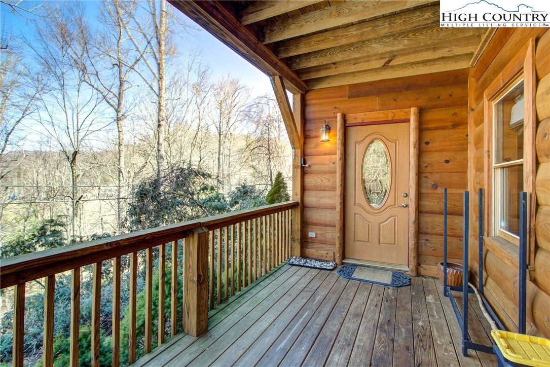 186 Riversound Drive Banner Elk, NC 28604 - Photo 2 of 45 a view of a wooden door with a glass door
