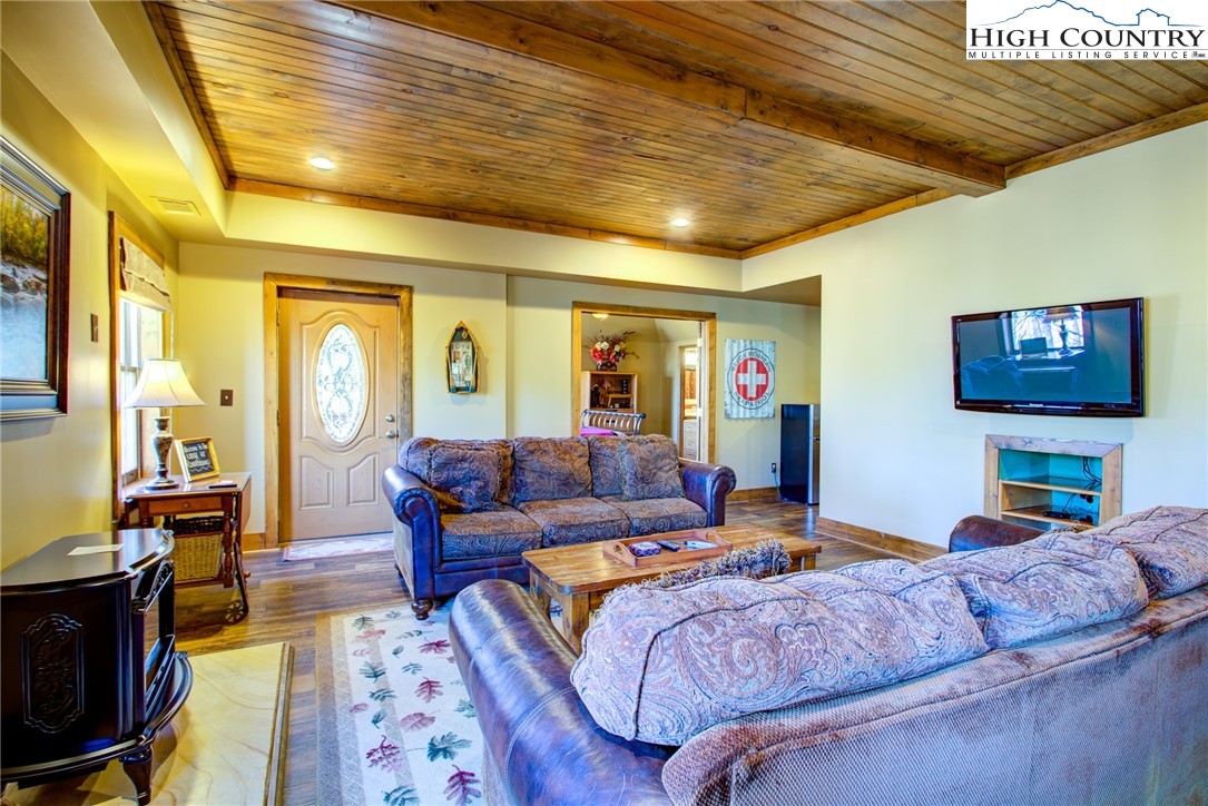 186 Riversound Drive Banner Elk, NC 28604 - Photo 3 of 45 a living room with furniture and a flat screen tv