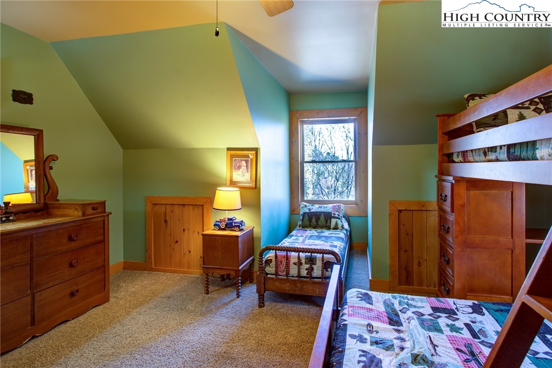 186 Riversound Drive Banner Elk, NC 28604 - Photo 36 of 45 a bedroom with a bed and wooden floor