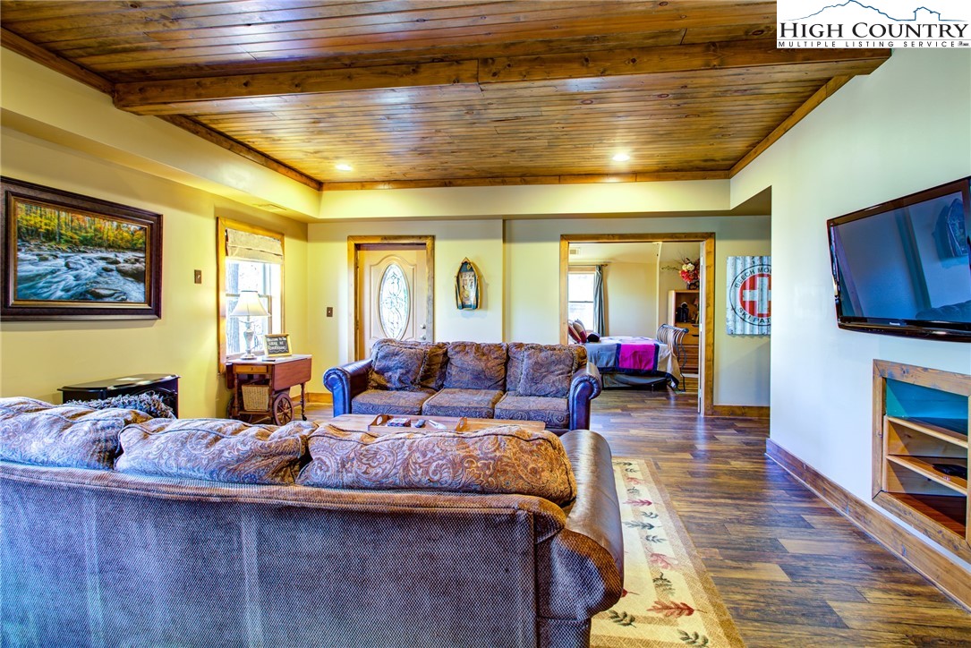 186 Riversound Drive Banner Elk, NC 28604 - Photo 4 of 45 a living room with furniture and a flat screen tv