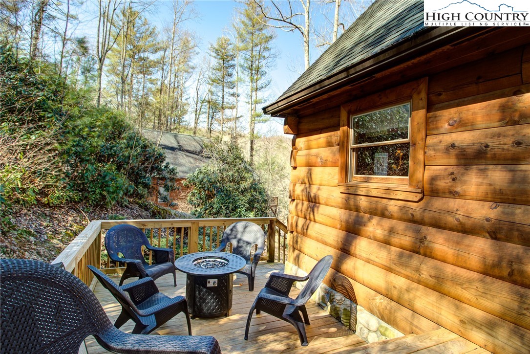 186 Riversound Drive Banner Elk, NC 28604 - Photo 41 of 45 a view of a chair and table in the balcony
