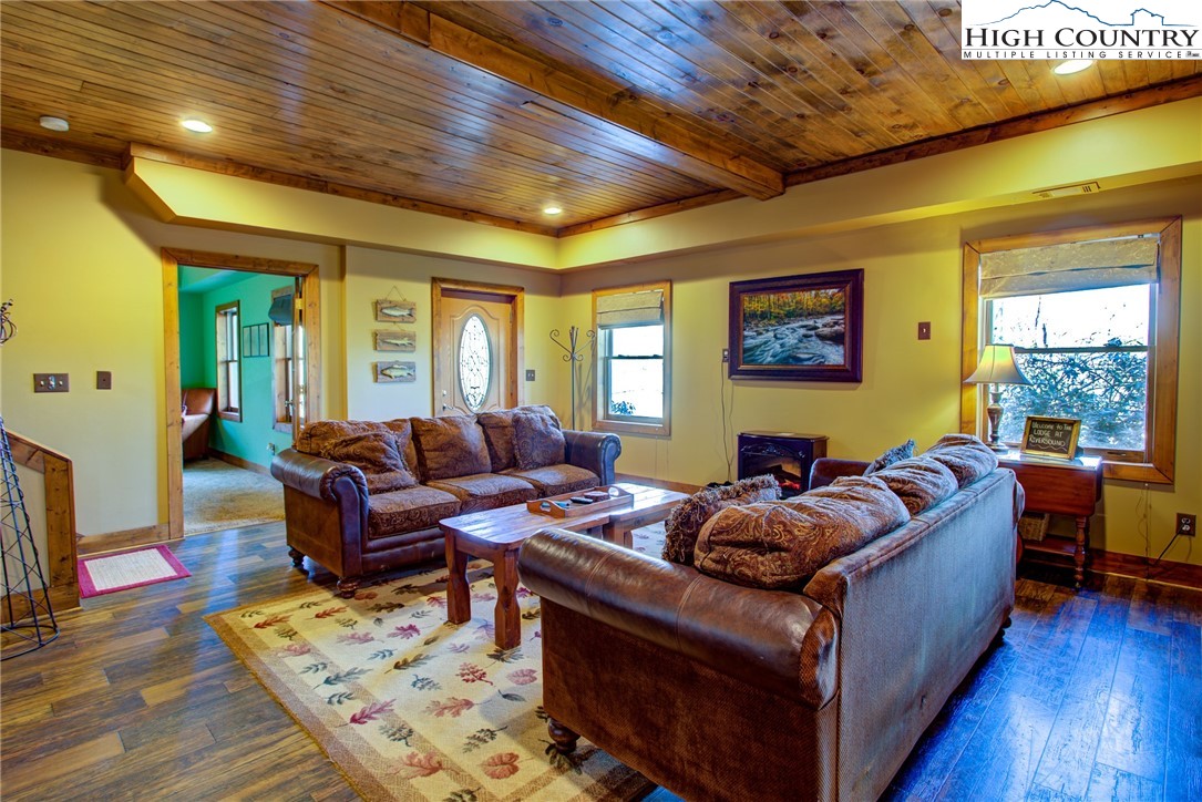 186 Riversound Drive Banner Elk, NC 28604 - Photo 5 of 45 a living room with furniture and a wooden floor