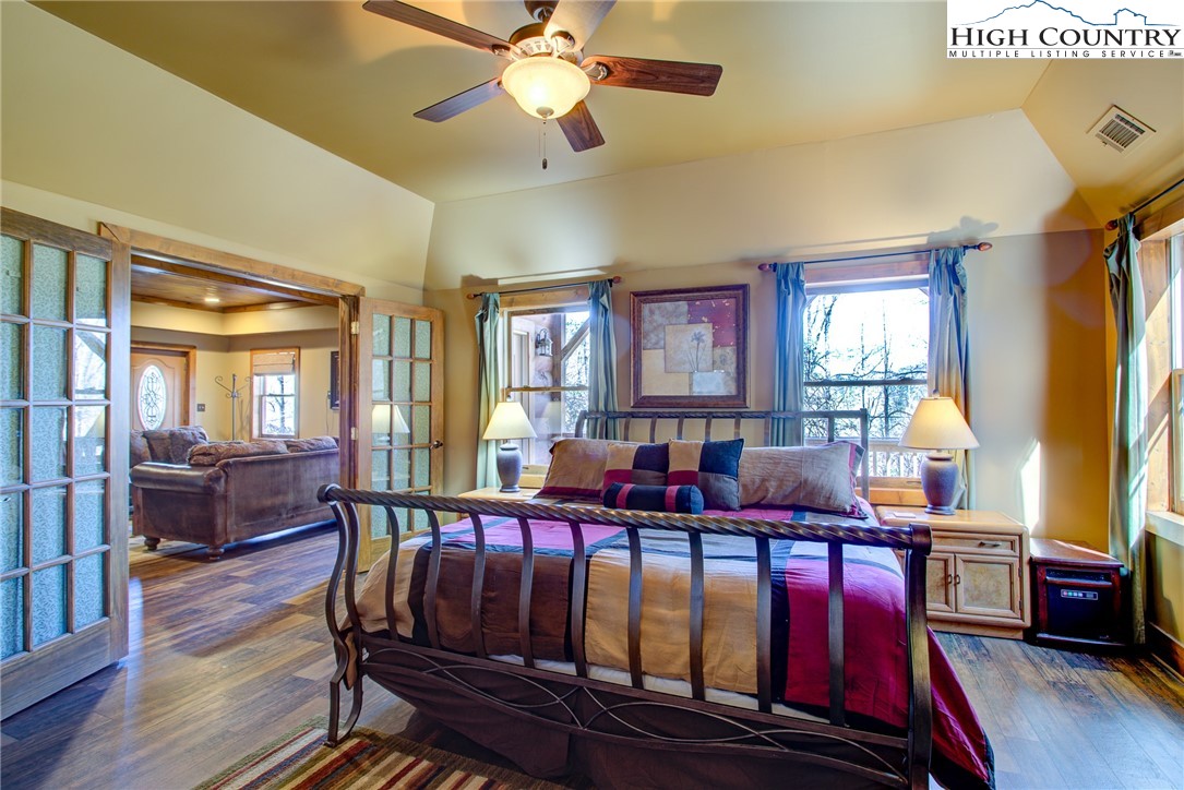 186 Riversound Drive Banner Elk, NC 28604 - Photo 7 of 45 a living room with furniture kitchen view wooden floor and windows