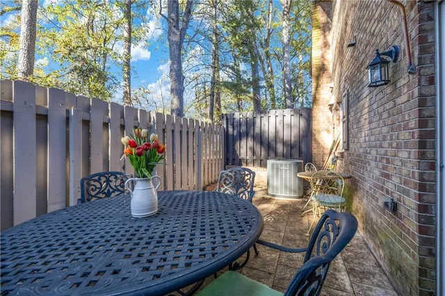 a view of outdoor space with a table and chairs