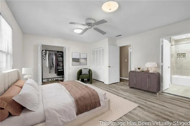 a bedroom with a large bed and a couch