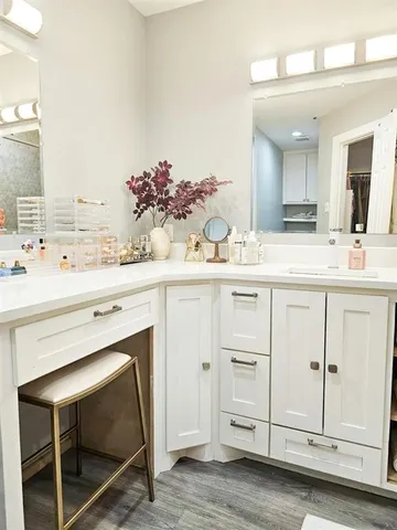 a bathroom with a sink vanity granite and a mirror