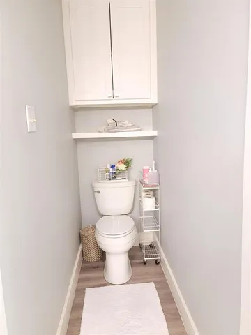 a kitchen with white cabinets appliances and sink