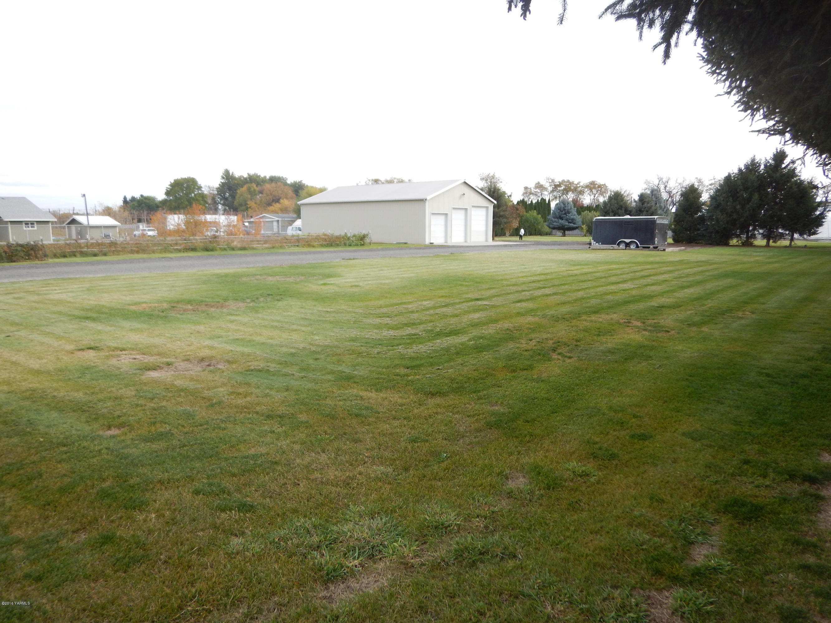 4911 Mieras Road Yakima, WA 98901 - Photo 22 of 58 a view of a field with an trees