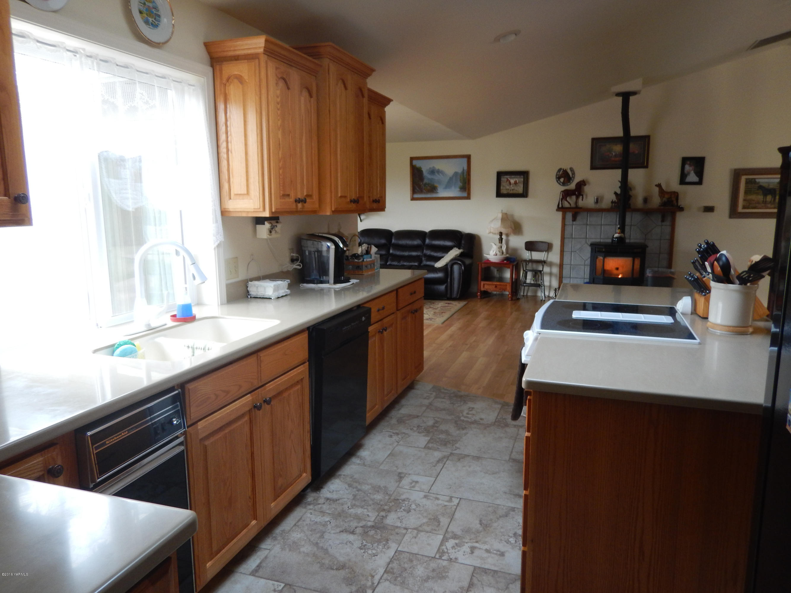 4911 Mieras Road Yakima, WA 98901 - Photo 36 of 58 a kitchen with sink cabinets and appliances