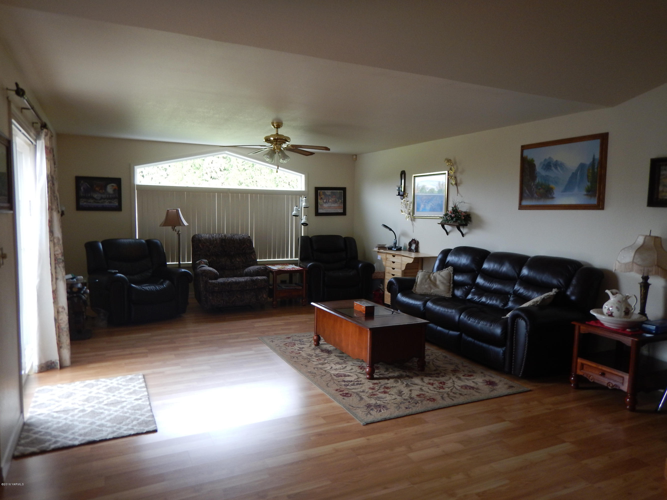 4911 Mieras Road Yakima, WA 98901 - Photo 41 of 58 a living room with furniture and a flat screen tv