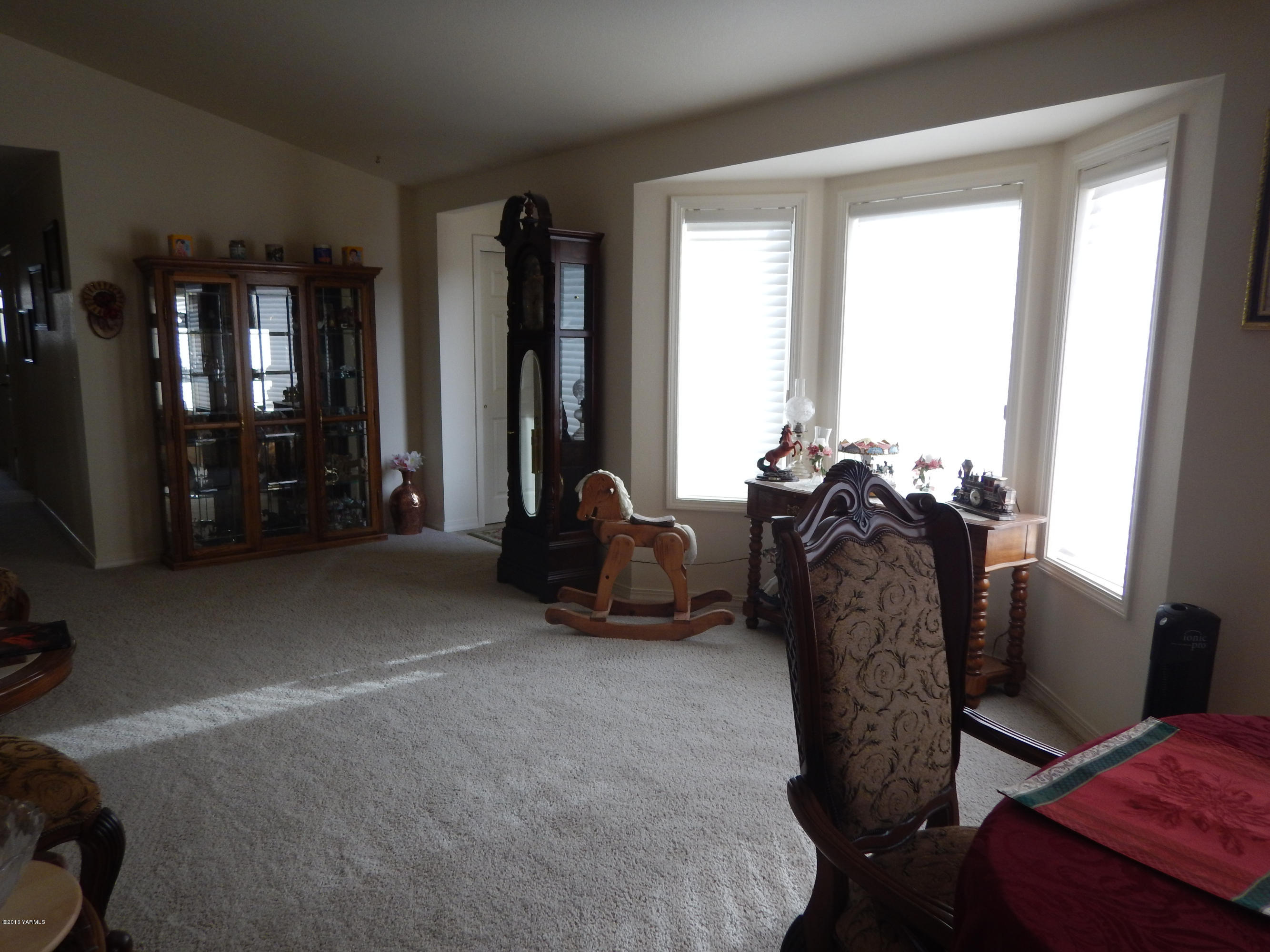4911 Mieras Road Yakima, WA 98901 - Photo 44 of 58 a living room with furniture a flat screen tv and windows